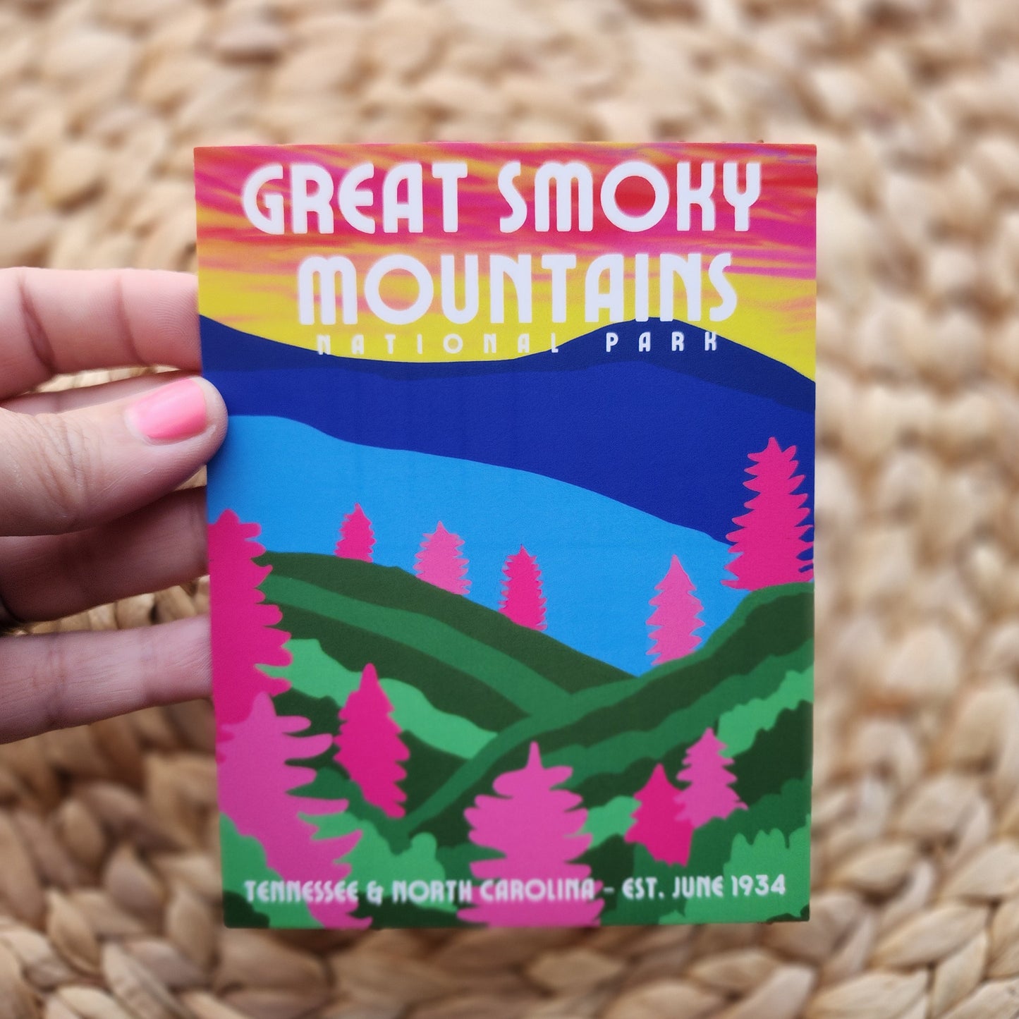 Sticker of Great Smoky Mountains National Park held over a woven surface