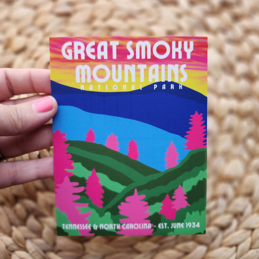 Sticker of Great Smoky Mountains National Park held over a woven surface