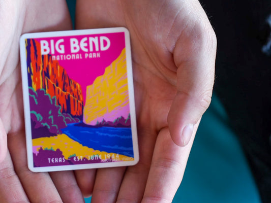 Colorful sticker of Big Bend National Park held in a hand